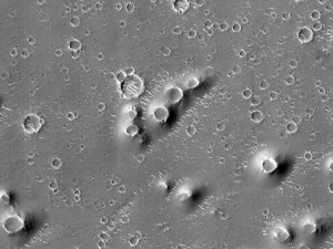 A field of pitted cones in Utopia Planitia on Mars, as observed by the HiRISE instrument onboard the Mars Reconnaissance Orbiter. Taken from http://beautifulmars.tumblr.com/post/82817530060/field-of-cones-in-utopia-planitia.